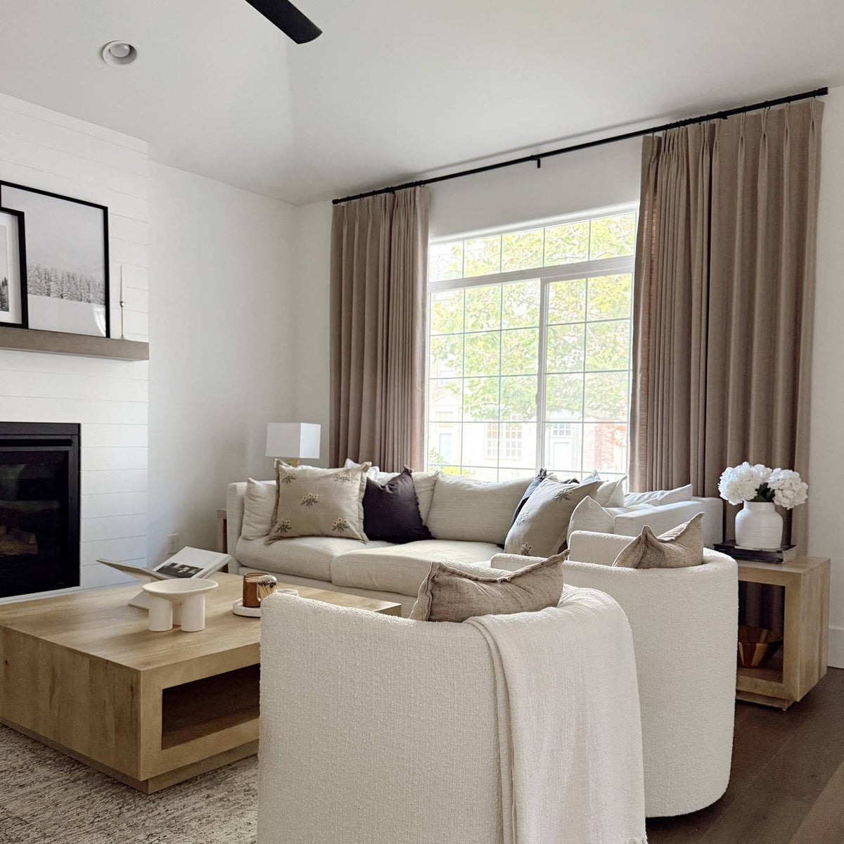 Lena Linen Soft Pebble-L2311 pleated drapery in a bright living and dining room