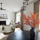 Lena Linen Soft Pebble-L2311 pleated drapery in a bright living and dining room